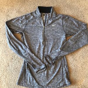 Nike running half zip pullover w/ thumb holes.